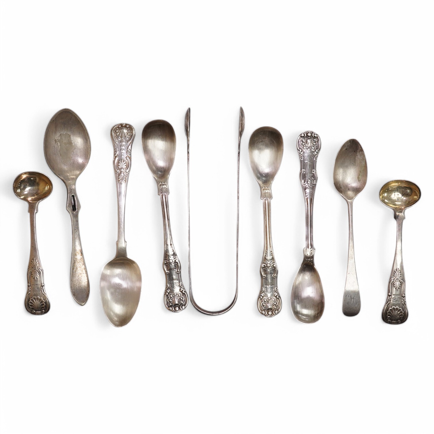 Five assorted 19th century Scottish silver condiment spoons, various dates and makers, a pair of George III silver sugar tongs, two other small silver spoons, 4.9oz and a silver plated preserve spoon. Condition - poor to